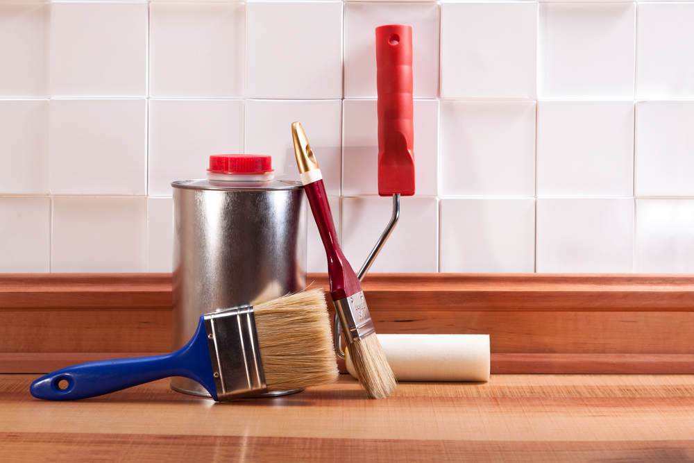 Brushes,,Rollers,And,Paint,Thinner,On,The,Floor,Parquet